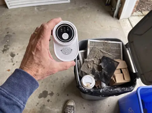 Old purifier filters in the garage trash, Ion Pure Pro in hand